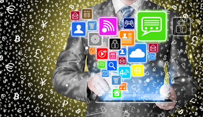 Business man using tablet PC with social media icon set