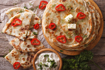 Indian paratha stuffed with potatoes close up. horizontal top view
