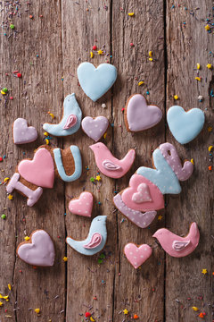 love gingerbread cookies on a wooden table. vertical top view
