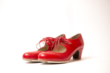 Red tango shoes on a white background