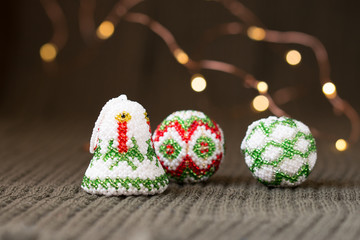 Beaded Christmas decoration on knitted surface