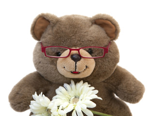ours en peluche souriant vieux a lunettes