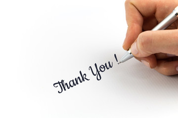Hand writing "Thank You!"  on white sheet of paper.