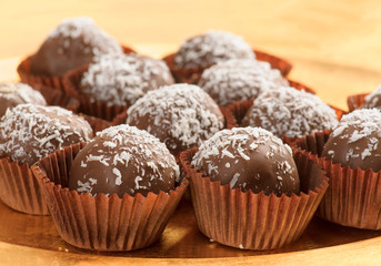 balls of chocolate covered coconut on golden tray