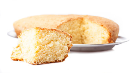 one piece of sponge cake isolated on a white background