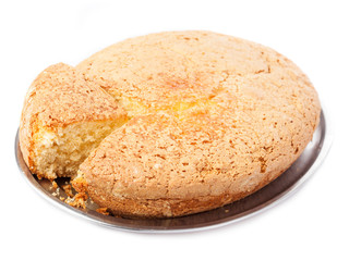 one piece of sponge cake isolated on a white background