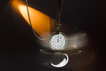 Antique silver pocket watch on a chain