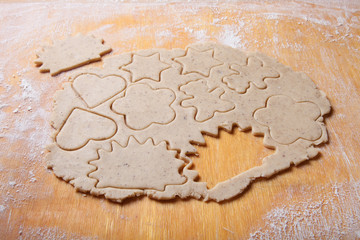 Dough for gingerbread cookie and cookie cutted in different shap