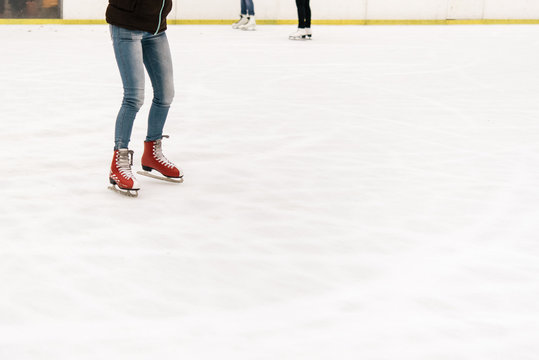 stylish happy skater on a white skating rink in a city center, h