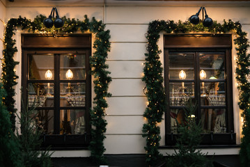 Fototapeta na wymiar stylish luxury christmas vintage garland on window, celebratio