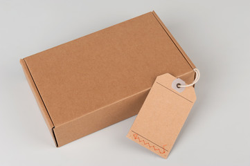 parcel. cardboard box with blank tag