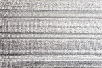 Insulation of attic with fiberglass cold barrier and reflective heat