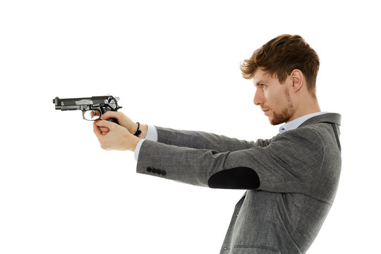 Young man using handgun