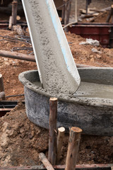 mixed concrete pouring at construction site