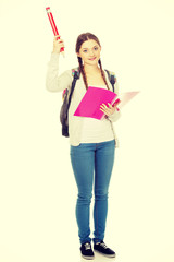 Happy student woman with big pencil.