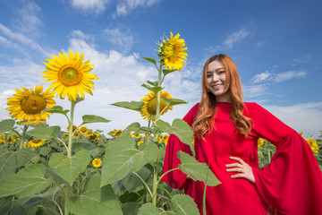 woman happy and enjoy in sunflower field