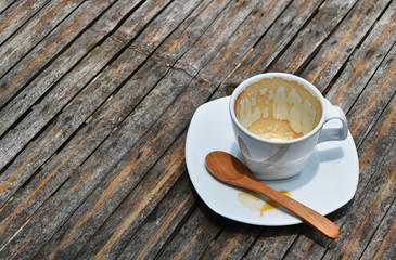 One finished cup of espresso coffee on bamboo table