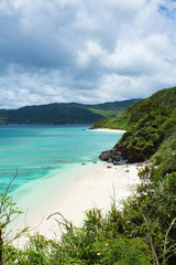 Secludued tropical beach coastline and clear water, Amami Oshima Island, Japan