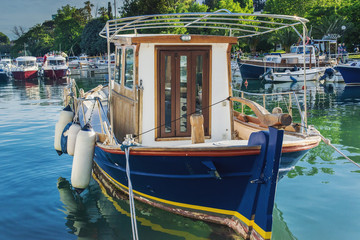Fototapeta na wymiar wooden boat near the shore in Budva