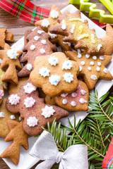 Colorful Christmas gingerbread cookies on wooden background