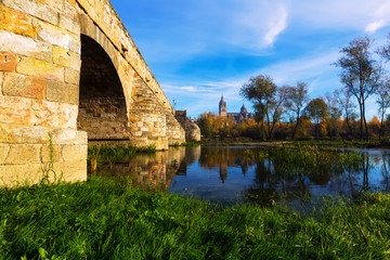 Fototapeta na wymiar Old bridge over Tormes River in Salamanca