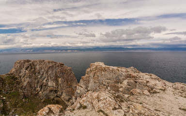 Fototapeta na wymiar The Lake Baikal. Mountains, Islands and waves. Russia.Озеро Байкал. Горы, острова и волны. Россия.