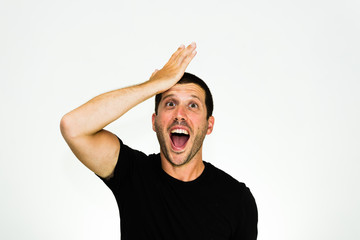 Close up of young caucasian man having a good idea, with black tshirt isolated on white background