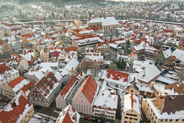 Winter panorama of medieval town within fortified wall. Top view from "Daniel" tower. Nordlingen, Bavaria, Germany.
