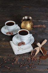 coffee cup background with coffee beans and chocolate candies