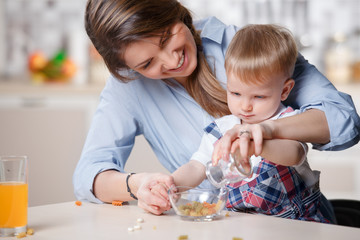 young mom playing with baby