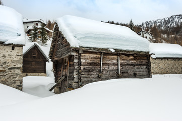 Old  houses covered by snow, Italy, Alps, Piemonte, Alpe Devero
