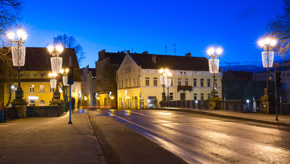Fototapeta na wymiar Illuminated bridge in the Old town of Klaipeda city, Lithuania.