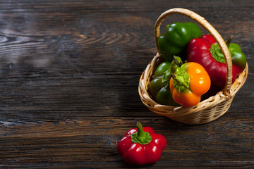 multicolored peppers in a wicker basket
