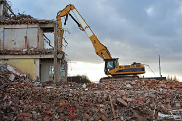 Construction Site Excavator Dismantling a Building
