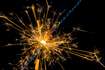 firework sparkler burning on black background, congratulation greeting  party happy new year,  christmas celebration