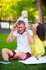 Fototapeta premium Portrait of a father, mother and baby