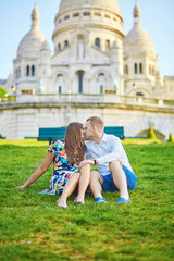 Romantic couple near Sacre-Coeur cathedral on Montmartre, Paris