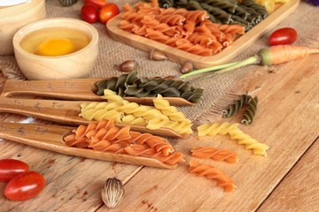 Raw homemade italian pasta colorful for cooking.