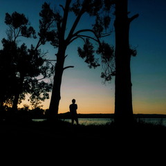 Man silhouette near the lake