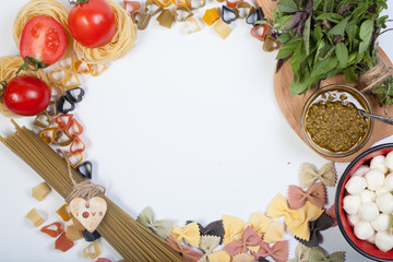 Italian Pasta with tomatoes, garlic, olive oil and pepper on a blanc notebook (with space for text)