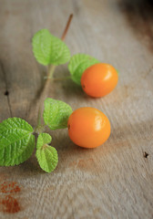 yellow tomatoes with mint leaves