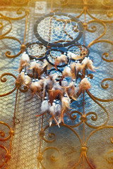 Dream Catcher and ornamental  window on background. vintage picture