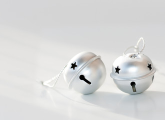 two round silver bell on a white background