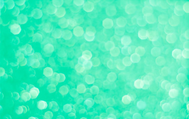 Abstract blurred green light spot bokeh background