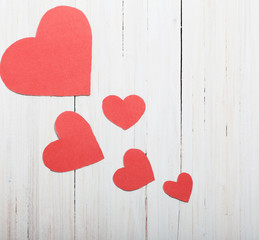 red hearts on old wooden background