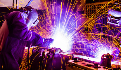 welder Industrial automotive part in factory - obrazy, fototapety, plakaty