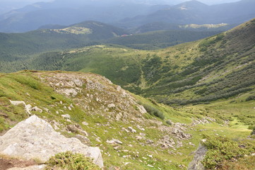 White sharp stones on the hillside on top of mountain range