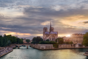 Sunset behind Notre-Dame cathedral in Paris