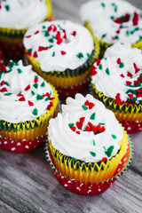 Christmas cupcakes on wooden background