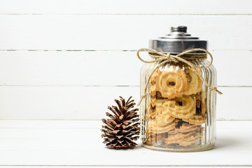 Danish butter cookies and pine cone on wood table, Still life wi